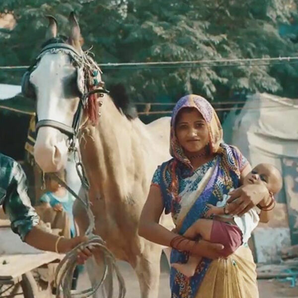 Woman with baby and horse